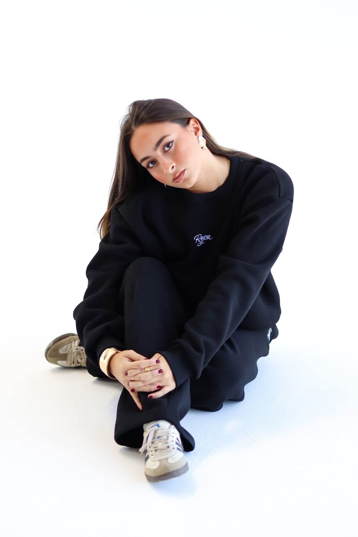Rayor Winter Collection in Black, lifestyle shot, seated pose